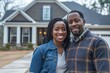 © Road Red Runner - A happy couple poses proudly in front of their newly purchased house, reflecting their shared success.