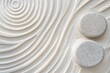© Elmira - Serene patterns in white sand create a calming atmosphere, enhanced by two meticulously placed stones, embodying simplicity and tranquility