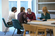 © Caia Image - Businesspeople talking in office