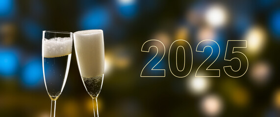 cheers two 2025 with two fizzy champagne flutes isolated on blurred bright background, happy new year greeting card banner