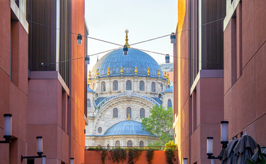 View of modern architecture building and historical architecture of  cihangir mosque in istanbul