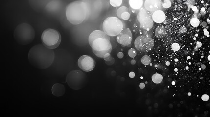 Blurred silver bokeh on black background