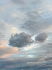 Little gray cloud traveling on the cloudy sky