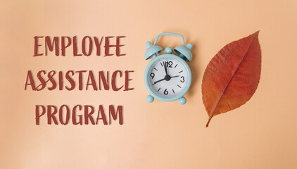 A clock is on a leaf with the words Employee Assistance Program written below it