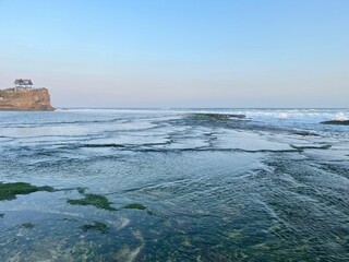 Wall Mural - The ocean is calm and the sky is clear