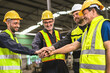 © lovelyday12 - group of construction workers are high fiving each other