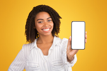 Poster - Modern Technology Concept. African american woman showing blank phone screen, mockup, selective focus