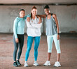 © Haas/peopleimages.com - Happy, fitness and portrait of group of women in city for workout, wellness gym and training class. Smile, sports and team of athletes with confidence for exercise by parking lot together in town.