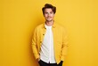 © munawaroh - A young man in a yellow jacket poses against a bright yellow background.