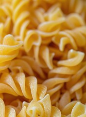 Canvas Print -   A macro shot of an array of pasta noodles with copious sauce drizzled over it and a fork positioned atop the center of the noodles