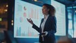 © WS Studio 1985 - Data-Driven Presentation: A confident businesswoman confidently presents data-driven insights on a large screen in a modern office setting.