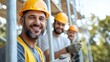 © LifeMedia - A smiling construction worker in a yellow hard hat and vest, standing confidently at the construction site with two coworkers in the background, embodying teamwork and job satisfaction.