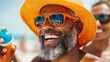 © LifeMedia - A man wearing an orange hat and sunglasses is enjoying a sunny day at the beach, holding a drink and basking in the warmth and relaxation of the pleasant weather.
