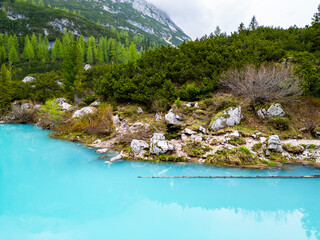 Aerial drone view of beautiful Lake Sorapis, Lago di Sorapis, in Dolomites, popular travel destination in Italy. Blue green lake in Italian Dolomites