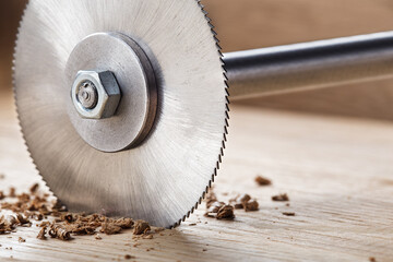 Wall Mural - Circular saw cutting wooden plank. Circular milling in oak block.