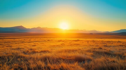 Distant Sunrise: Vivid Yellow Scenery with Mountains in the Background