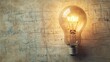 © Nuttaya Nampai - Aerial view of a light bulb with a creative doodle inside, symbolizing a bright idea on paper.