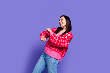 Poster - Photo of adorable cool girl wear pink cardigan dancing empty space isolated purple color background