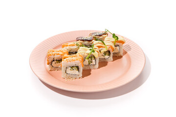 Canvas Print - Assorted Sushi Rolls with Shrimp, Salmon, and Eel on a Pink Plate