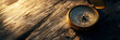 © Matthias - Miscellaneous banner with compass close-up on wooden surface, soft lighting, space for text
