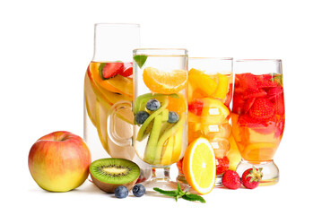 Wall Mural - Glasses and bottle of infused water with different sliced fruits on white background