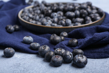 Sticker - Plate with sweet fresh blueberries on blue background