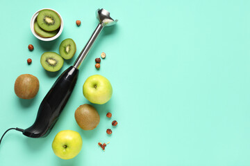 Wall Mural - Blender, nuts, apples and pieces of kiwi on turquoise background