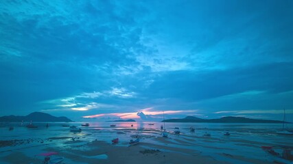 Wall Mural - Time lapse blue cloud moving above the marina of fishing boat at twilight.
beautiful sky in nature and travel concept.4K resolution.
scenery blue sky in sunrise on the islands background.