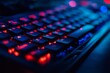 © MUHAMMAD - Close-up of Backlit Gaming Keyboard with Red and Blue Lighting