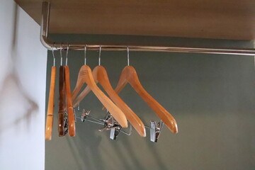 brown clothes hanger lay on the top