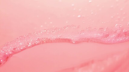 Poster - Discover mesmerizing patterns in soft pink sand along the shore, with gentle waves creating a tranquil atmosphere.