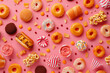 © Lazy_Bear - Delicious pattern with assortment of colorful sweets and pastries. Donuts, cupcakes, and cookies on bright background.