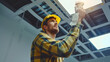 © Mahemud - Technician Holding Recessed Mounted Luminaire: Technician repairing or maintaining a recessed