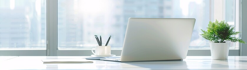Poster - a high-resolution photo of a clean and modern office workspace with a laptop and notepad, soft natur