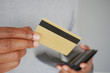 © Towfiqu Barbhuiya  - close up of person hand holding credit card