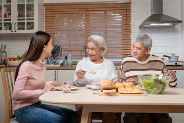 Wall Mural - Asian lovely family having dinner enjoy eating party in house together. 