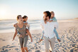 © peopleimages.com - Beach, family and piggyback with children at sunset for outdoor holiday, adventure and weekend trip. Happy, father and mother with kids by ocean in summer for fun vacation, love and travel in Florida