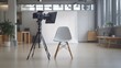 © Sam-th - Camera on tripod and a white chair in a modern studio.