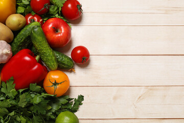 Wall Mural - Different vegetarian products on light wooden table, top view. Space for text