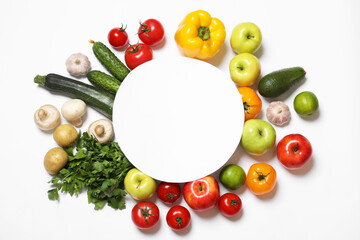 Canvas Print - Healthy vegetarian food. Paper card surrounded by different vegetables, mushrooms and fruits on white background, flat lay