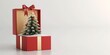 © SRENStock - Opened christmas gift box , golden ribbon , christmas tree