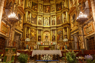 Baroque Guadalupe church interior. Decorated altar. Caceres, Extremadura. Spain