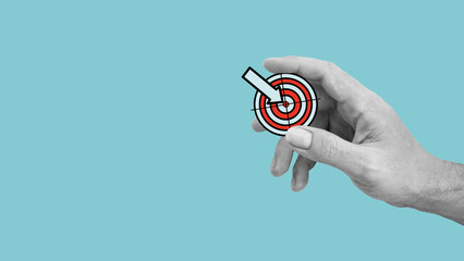 Poster - Hand holding a target. Goal achievement, business and finance concept. Work success and wins. Copy space for the text or logo