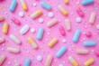 © Leo Rohmann - Colorful Capsules and Pills Scattered Across a Bright Pink Surface