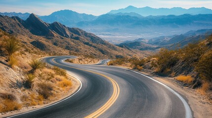 Wall Mural - Scenic mountain road with sweeping curves surrounded by vast open spaces. Great for road trip and travel guides