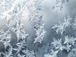 © pavlofox - Frost patterns on a window during a cold winter morning