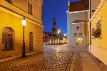 Wall Mural - Facades of old multi-colored houses on the Town Hall Square in Poznan in the light of lanterns