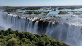 Wild Water Falls At Victoria Falls In Matabeleland North Zimbabwe. Giant Waterfalls. Nature Landscape. Victoria Falls At Matabeleland North Zimbabwe. Zambezi River. Travel Scenery.