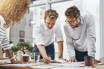 Poster - Writing, group and planning with paperwork in meeting, creative and brainstorming of interior designer. Explaining, employees and reading for collaboration, ideas and people in office for project