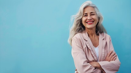 Happy Middle Aged Woman on a Blue Background with Space for Copy